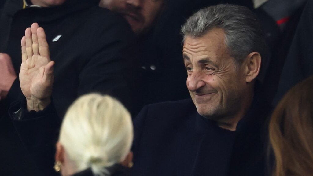 Former French president Nicolas Sarkozy looks on from the stands as he attends a football match at the Parc des Princes stadium in Paris on September 27, 2025.