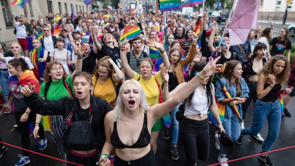 Participants of a gay pride parade walk through the streets of Poznań, Poland on August 11, 2018.