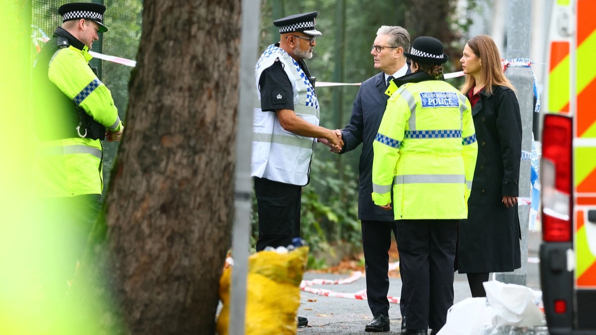 Britain’s Prime Minister Keir Starmer and his wife Victoria react as they visit the scene outside Heaton Park Hebrew Congregation synagogue in Crumpsall, north Manchester, on October 3, 2025