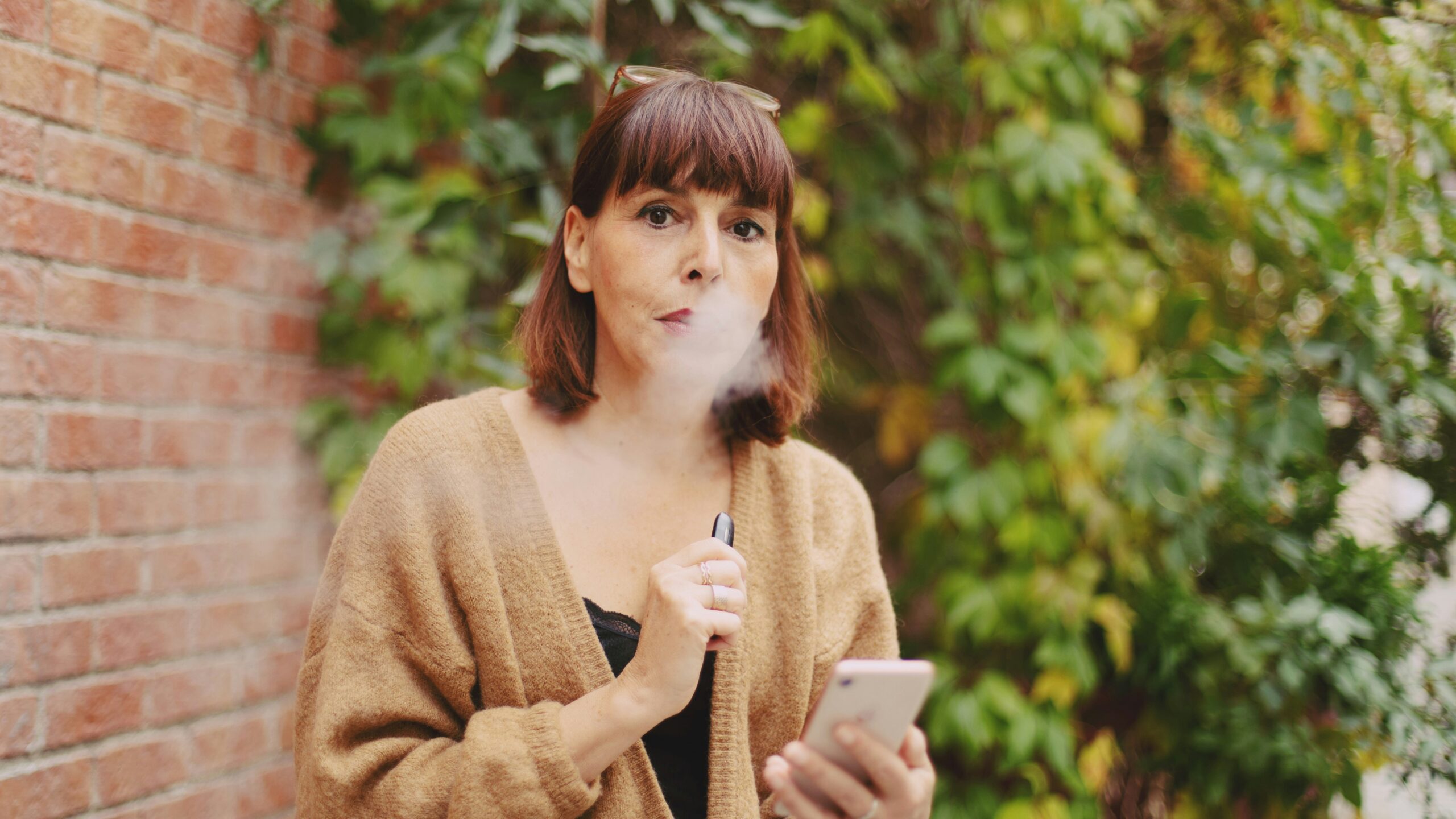 Woman vaping (Unsplash)