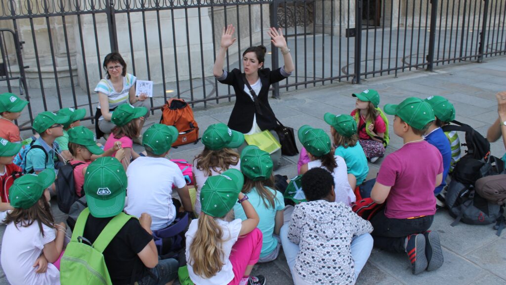 French schoolchildren listen to a teacher outside the Notre Dame in Paris in 2014.