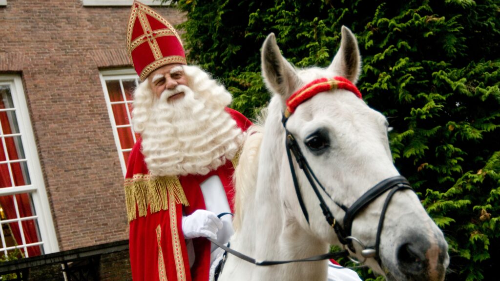 A man on horseback dressed as Sinterklaas