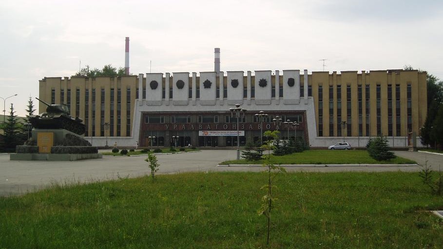 One of the buildings of Uralvagonzavod (Nizhny Tagil, Russia). A T-34 tank is displayed to the left.
