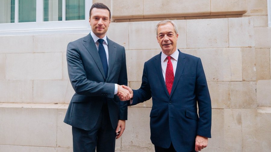Rassemblement National president Jordan Bardella (L) shakes hands with Reform UK leader Nigel Farage in London on December 9, 2025
