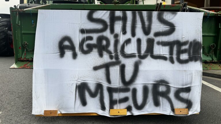 A placard on a tractor that reads "Without agriculture you die" seen during a farmers' protest in Brussels, Belgium on December 18, 2025