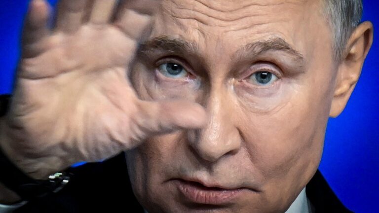 Russia’s President Vladimir Putin gestures as he speaks during his annual end-of-year press conference, in Moscow, on December 19, 2025.