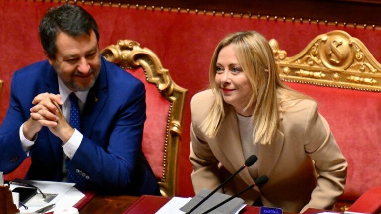 Deputy Prime Minister and Minister of Infrastructure Matteo Salvini sits next to Italy's Prime Minister Giorgia Meloni at the Italian Senate in Rome on October 22, 2025.