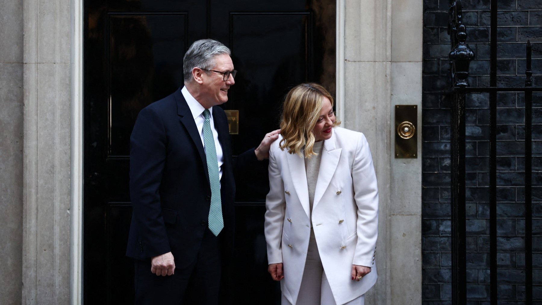 UK Prime Minister Keir Starmer (L) speaks with Italy’s Prime Minister Giorgia Meloni as he welcomes her upon arrival outside 10 Downing Street on March 2, 2025 ahead of a European leaders’ summit.