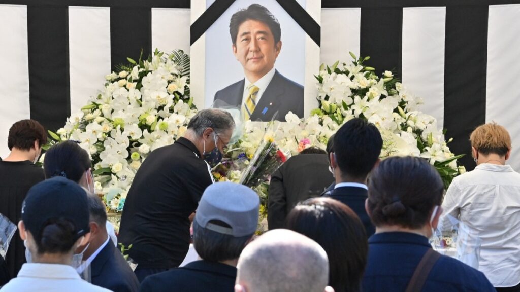 People offering their respects to former Japanese prime minister Shinzo Abe outside the Nippon Budokan in Tokyo, ahead of his state funeral later in the day, on September 27, 2022.
