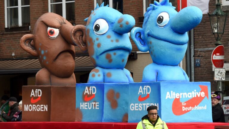 A carnival float, depicting Germany’s right-wing populist AfD party metamorphosing from a blue to a brown character, stands in front of the city hall in Düsseldorf, Germany on February 8, 2016.