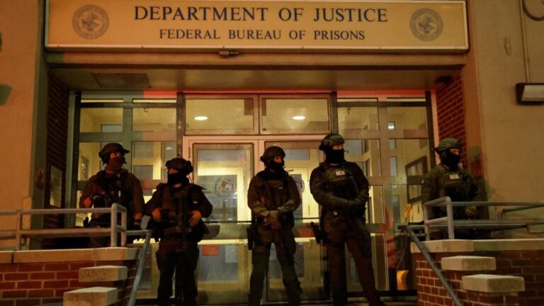 Armed police officers stand in front of the Metropolitan Detention facility in the Brooklyn borough of New York, where ousted president Nicolás Maduro is expected to be held, on January 3, 2026 in New York City.