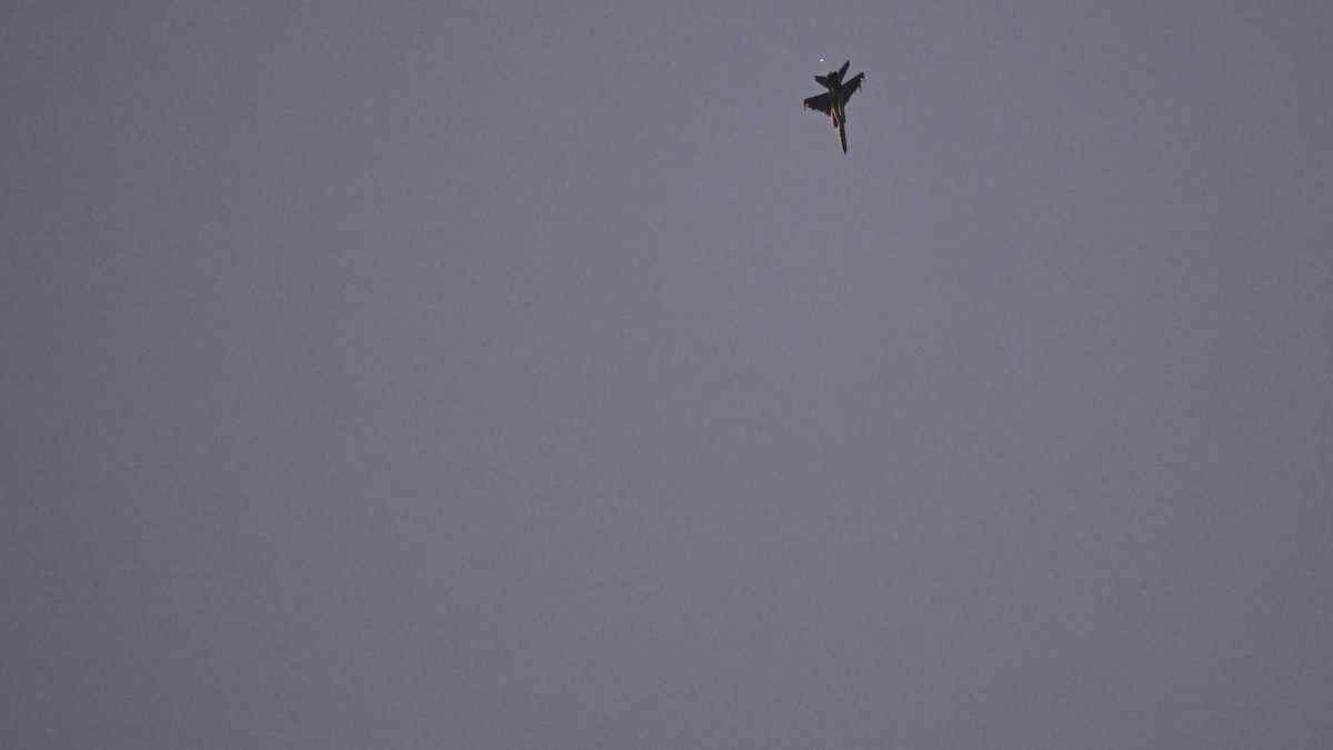 A Chinese JH-7A fighter-bomber aircraft flies over the Taiwan Strait as seen from Pingtan Island, the closest point to Taiwan, in eastern China’s Fujian province on December 29, 2025.