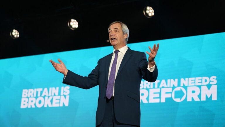 Reform UK Leader Nigel Farage addresses delegates during a Reform UK party political rally at Newark Showground in Newark upon Trent, central England, on January 19, 2026.