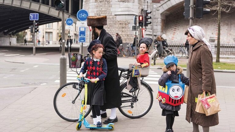 A Hasidic Jewish family dressed in costumes for Purim in Antwerp, Belgium, March 24, 2016.
