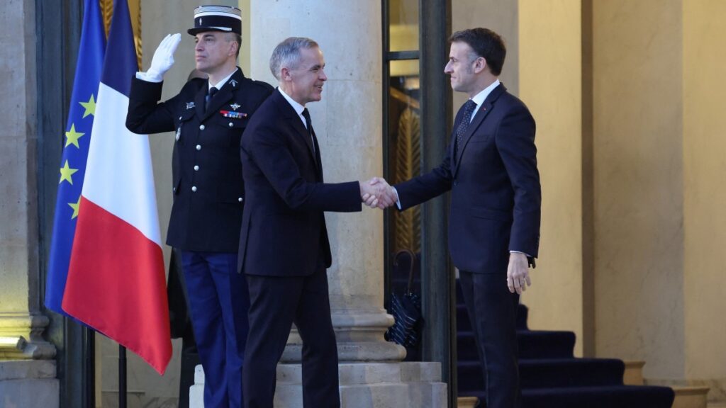 France’s President Emmanuel Macron (R) welcomes Canada’s Prime Minister Mark Carney at The Élysée Presidential Palace in Paris on January 6, 2026, prior to the Coalition of the Willing summit on security guarantees for Ukraine.