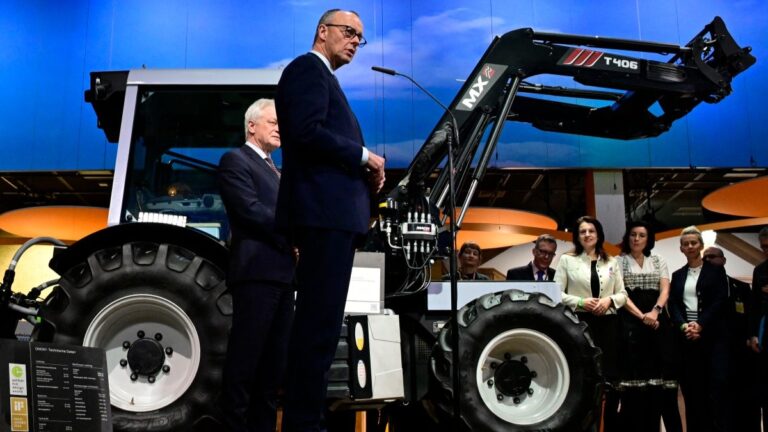German Chancellor Friedrich Merz stands in front of an Onox1 electric tractor as he delivers a statement at the end of his tour at the Grüne Woche (‘Green Week’) International Agriculture Fair in Berlin on January 20, 2026.