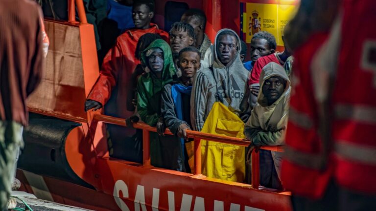 Migrants wait to disembark from a vessel of the Spanish Sea Search and Rescue Agency at La Restinga port on the Canary Island of El Hierro, on September 20, 2024.