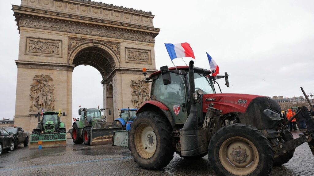 Tractors are seen parked in front of the Arc de Triomphe during a demonstration of French agricultural union Coordination Rurale (CR) as part of a nationwide day of protests and actions on January 8, 2026.