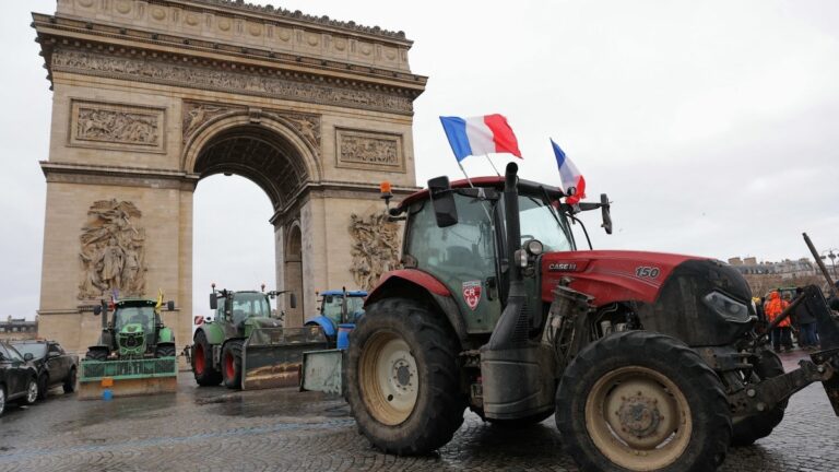 Tractors are seen parked in front of the Arc de Triomphe during a demonstration of French agricultural union Coordination Rurale (CR) as part of a nationwide day of protests and actions on January 8, 2026.