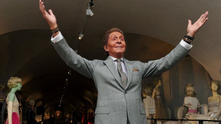 Italian couturier Valentino Garavani poses for photographs at the launch of his exhibition 'Valentino: Master of Couture' at Somerset House in central London on November 28, 2012.