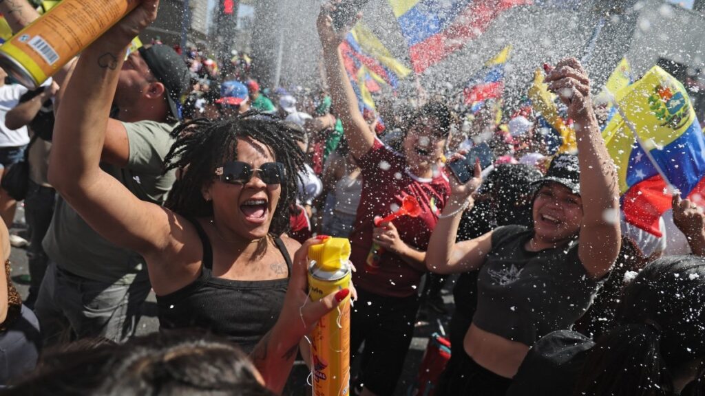 Venezuelans living in Chile celebrate in Santiago on January 3, 2026, after U.S. forces captured Venezuelan leader Nicolás Maduro.