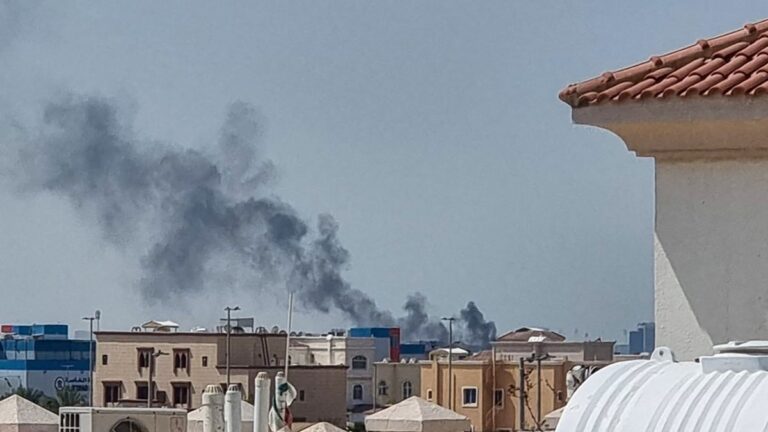 A smoke plume rises over Abu Dhabi from the site of an Iranian missile strike on February 28, 2026.