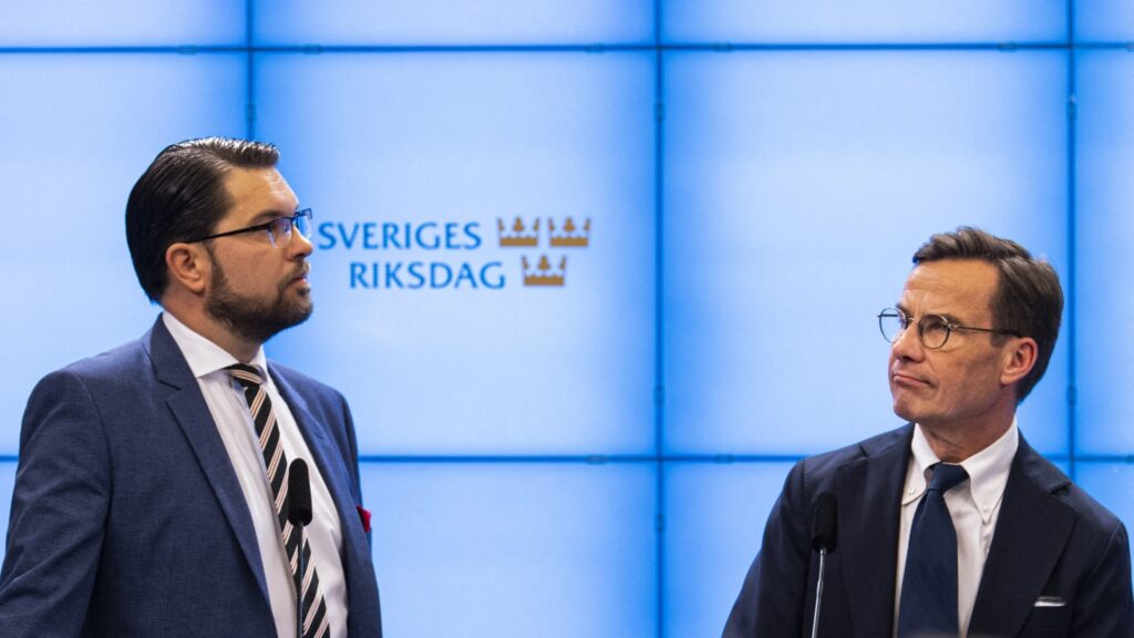 Leader of the Sweden Democrats Jimmie Åkesson (L) and leader of the Moderate party Ulf Kristersson address a press conference on the formation of a coalition government at the Parliament press office in Stockholm, Sweden on October 14, 2022.