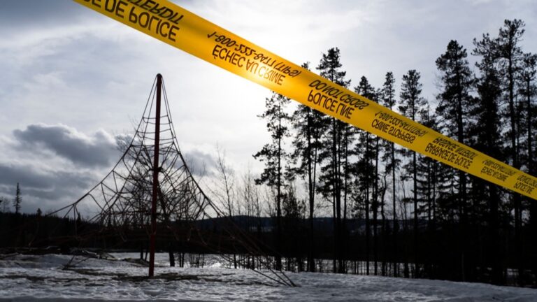 Police tape marks off Tumbler Ridge Secondary School where a shooting took place, leaving at least nine people dead in the small town of Tumbler Ridge, British Columbia, on February 11, 2026.