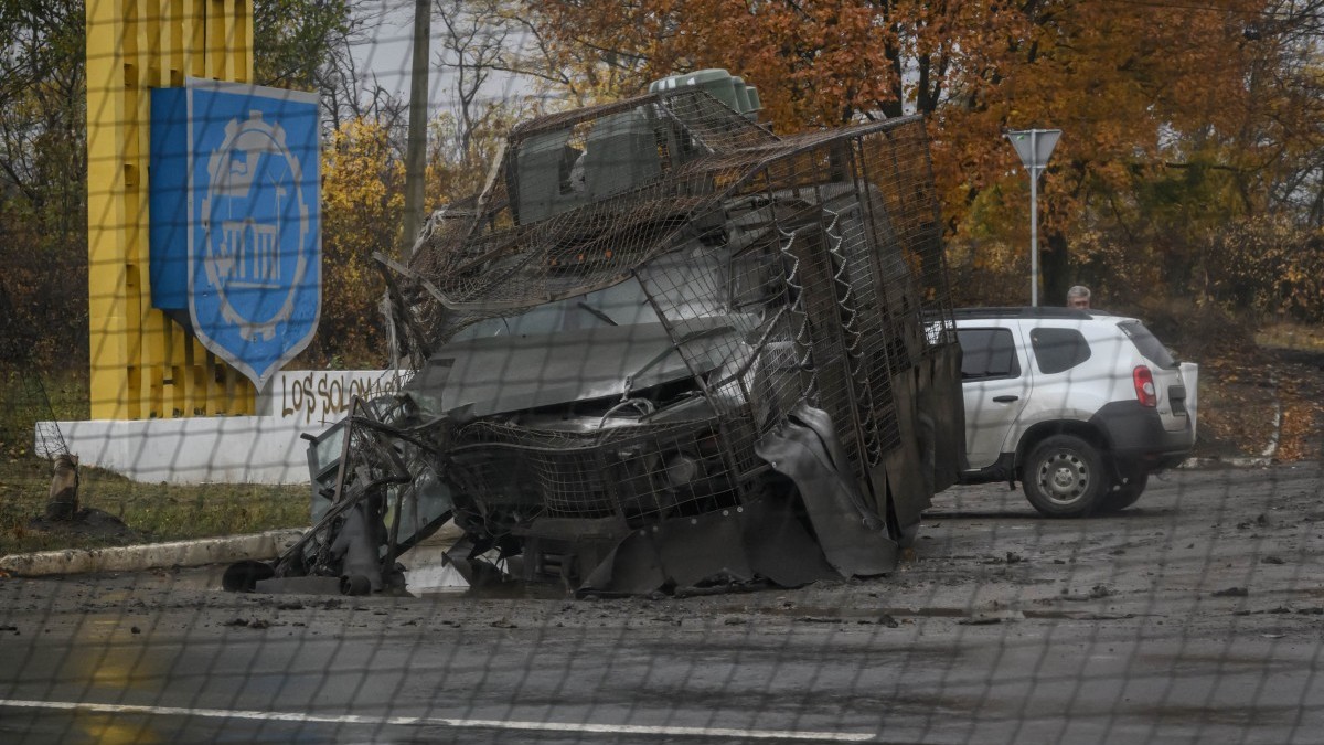 A Ukrainian armoured personnel carrier, damaged during a Russian FPV drone strike, lies at a roadside near Druzhkivka, in the Donetsk Oblast, in eastern Ukraine, on October 10, 2025.