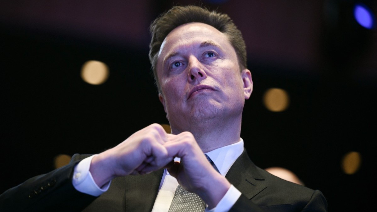 Elon Musk looks on as U.S. President Donald Trump speaks at the U.S.-Saudi Investment Forum in Washington, D.C. on November 19, 2025.