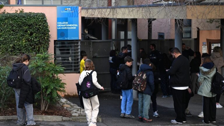 Students stand at the entrance of La Guicharde secondary school in Sanary-sur-Mer, south-eastern France on February 3, 2026, following the stabbing of a teacher by a student.