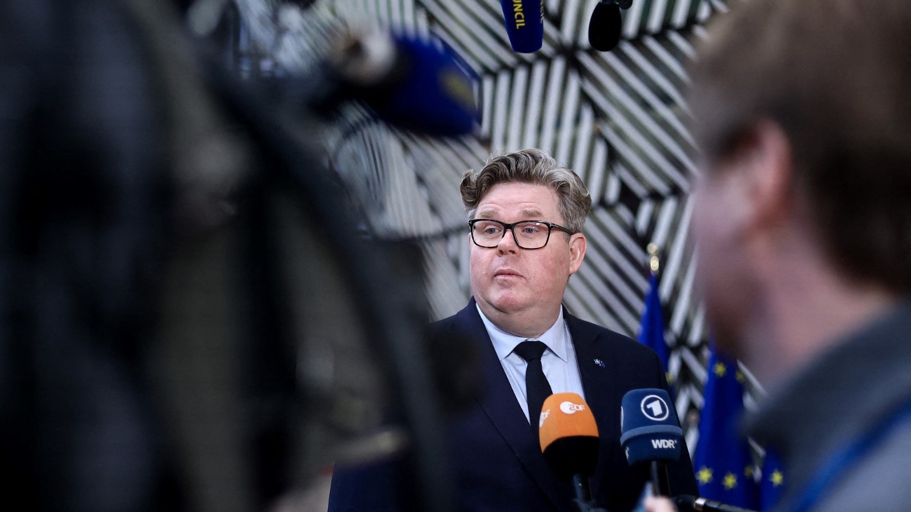 Sweden’s Minister for Justice Gunnar Strömmer talks to the press as he arrives for a Justice and Home Affairs Council at the EU headquarters in Brussel on March 9, 2023.