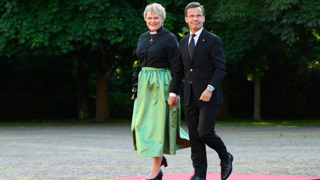 Sweden’s Prime Minister Ulf Kristersson (R) and his wife, Birgitta Ed arrive for a social dinner at the ‘Huis ten Bosch’ Royal Palace during a NATO Heads of State and Government summit in The Hague, on June 24, 2025.