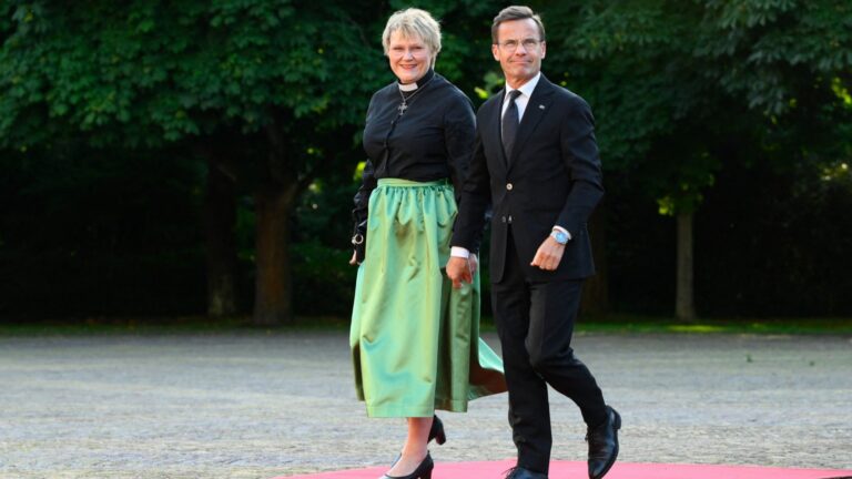 Sweden’s Prime Minister Ulf Kristersson (R) and his wife, Birgitta Ed arrive for a social dinner at the ‘Huis ten Bosch’ Royal Palace during a NATO Heads of State and Government summit in The Hague, on June 24, 2025.