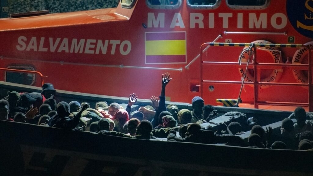 Migrants wait to disembark a boat that arrived early on September 22, 2024 at La Restinga port, after being rescued by the Spanish Salvamento Maritimo (Sea Search and Rescue agency) Salvamar Adhara vessel, off the Canary Islands.