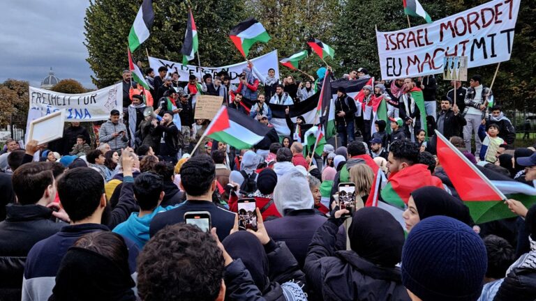 People wave Palestinian flags and shout slogans in support of Palestine during a Pro-Palestinian demonstration outside the Chancellery in Vienna, Austria on October 15, 2023.