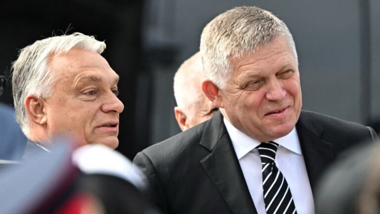 Slovak Prime Minister Robert Fico (R) and Hungarian Prime Minister Viktor Orbán attend the ceremony to celebrate the 130th anniversary of the Mária Valéria Bridge that spans the Danube connecting the two countries, on September 28, 2025.
