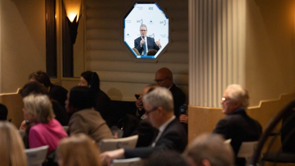 Britain’s Prime Minister Keir Starmer reflects in a mirror as he speaks during the 62nd Munich Security Conference on February 14, 2026 in Munich, southern Germany.