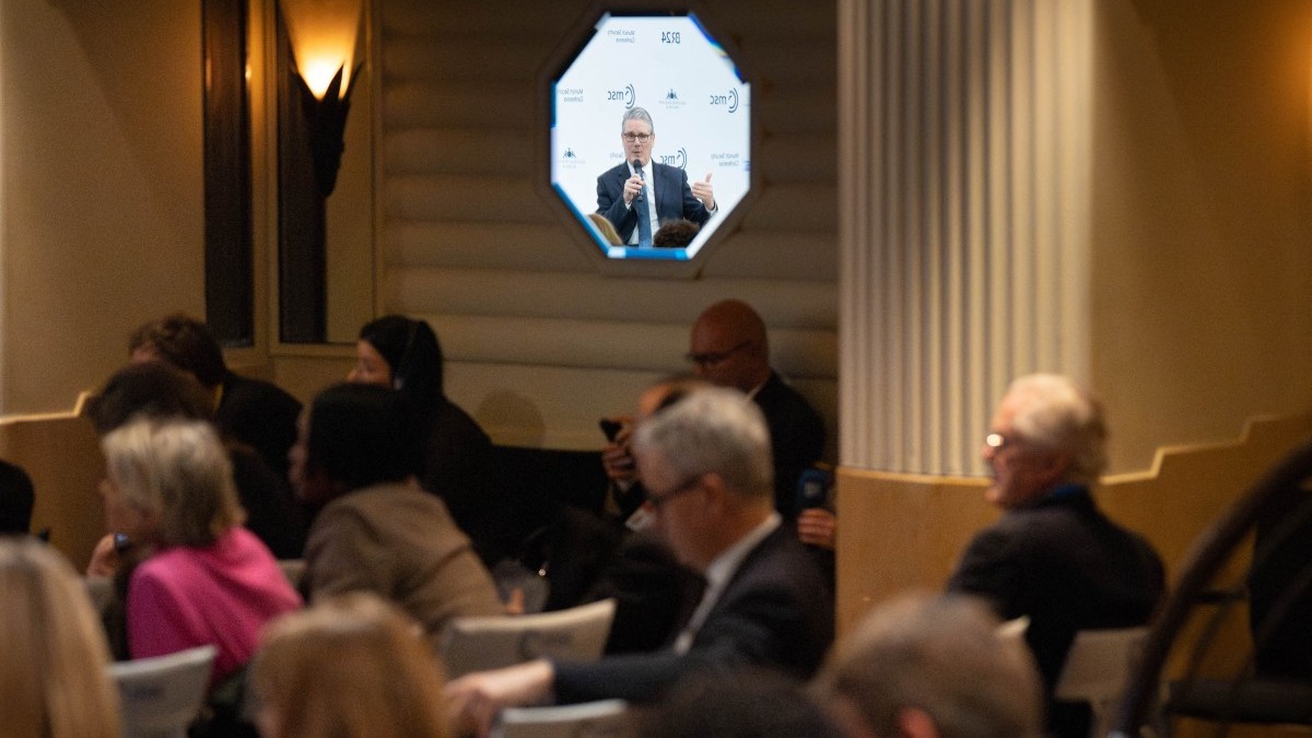 Britain’s Prime Minister Keir Starmer reflects in a mirror as he speaks during the 62nd Munich Security Conference on February 14, 2026 in Munich, southern Germany.