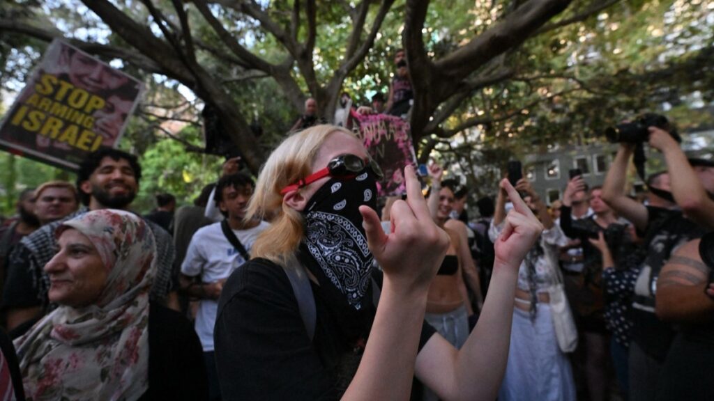 Pro-Palestinian protesters gather in front of a police station in Sydney on February 10, 2026, to condemn the police crackdown on protesters demonstrating against Israeli President Isaac Herzog's visit to Australia.