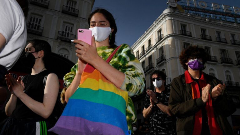 People applaud during a gathering marking the International Transgender Day of Visibility (TDOV) in Madrid on March 31, 2021.