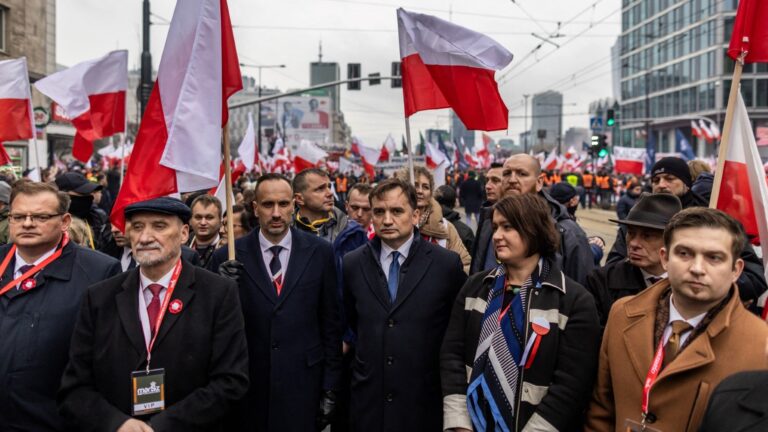 Polish Justice Minister Zbigniew Ziobro (C) attends the country's Independence Day march organised by patriotic groups in Warsaw on November 11, 2022.