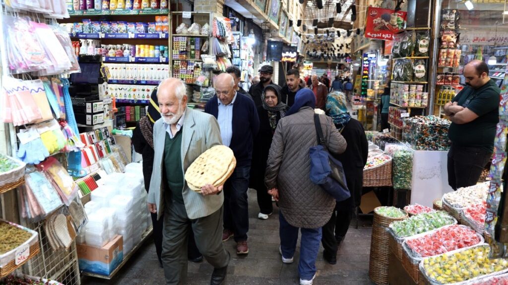 Iranians shop at the Tajrish Bazaar in Tehran on March 24, 2026.