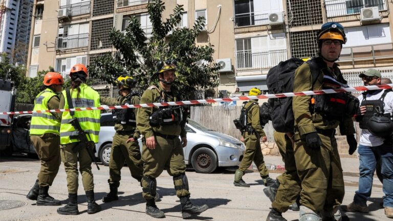 Israeli security forces and first responders gather at the site of an Iranian strike that hit a residential neighbourhood in Bat Yam, south of Tel Aviv, on March 9, 2026.