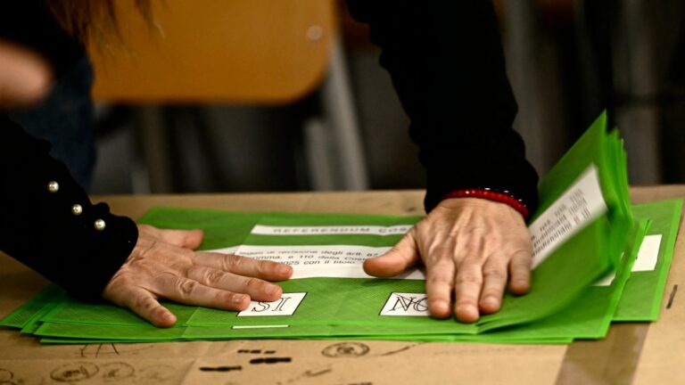 A person prepares the counting of the ballot boxes of the constitutional referendum on justice reform, in a polling station of Rome on March 23, 2026.