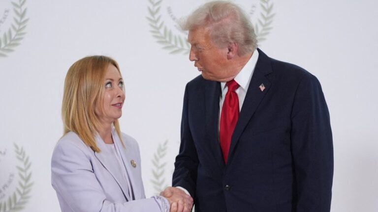 U.S. President Donald Trump greets Italy's Prime Minister Giorgia Meloni during a summit on Gaza in Sharm el-Sheikh on October 13, 2025.