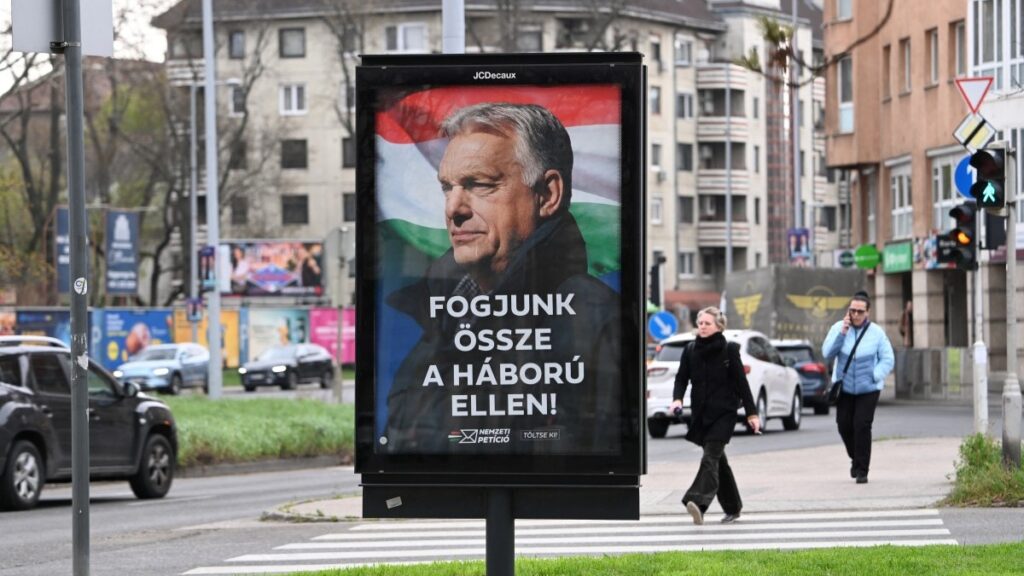 A billboard featuring a portrait of Hungarian Prime Minister Viktor Orbán with the text reading “Let’s join forces against the war, is seen in Budapest on March 27, 2026, ahead of the parliamentary elections on April 12, 2026.