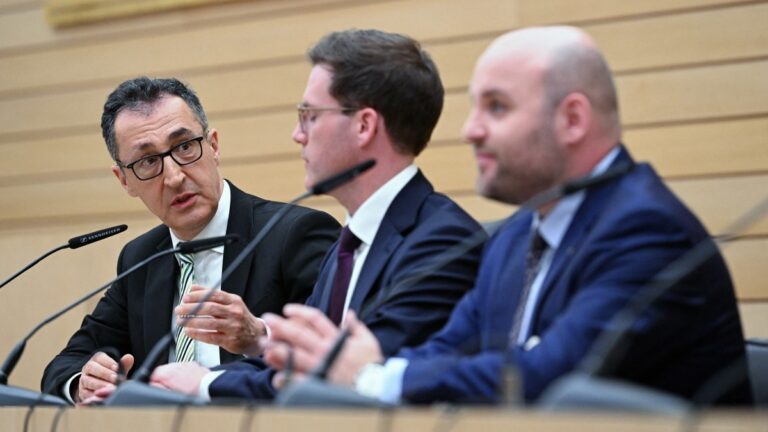 Cem Özdemir, top candidate of the Greens, Manuel Hagel, top candidate of Christian Democratic Union (CDU) and Markus Frohnmaier, top candidate of the far-right Alternative for Germany (AfD) (L-R) address a press conference at the regional parliament after exit polls were announced in the state elections on March 8, 2026 in Stuttgart, southern Germany.