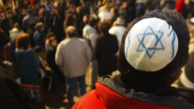 Participants at a rally on March 24, 2004 held at the Lipa Green Centre in Toronto, Canada to support religious tolerance after a series of anti-semitic attacks struck synagogues