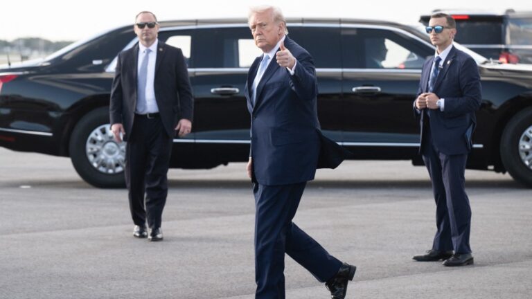 U.S. President Donald Trump gives a thumbs up after disembarking Air Force One at Palm Beach International Airport in West Palm Beach, Florida, on March 20, 2026, en route to his Mar-a-Lago resort.